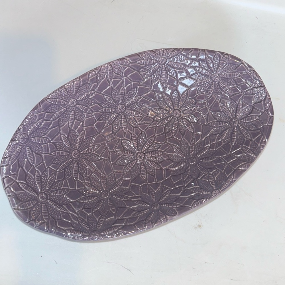 Handcrafted grasslands road bowl. Purple textured inside.